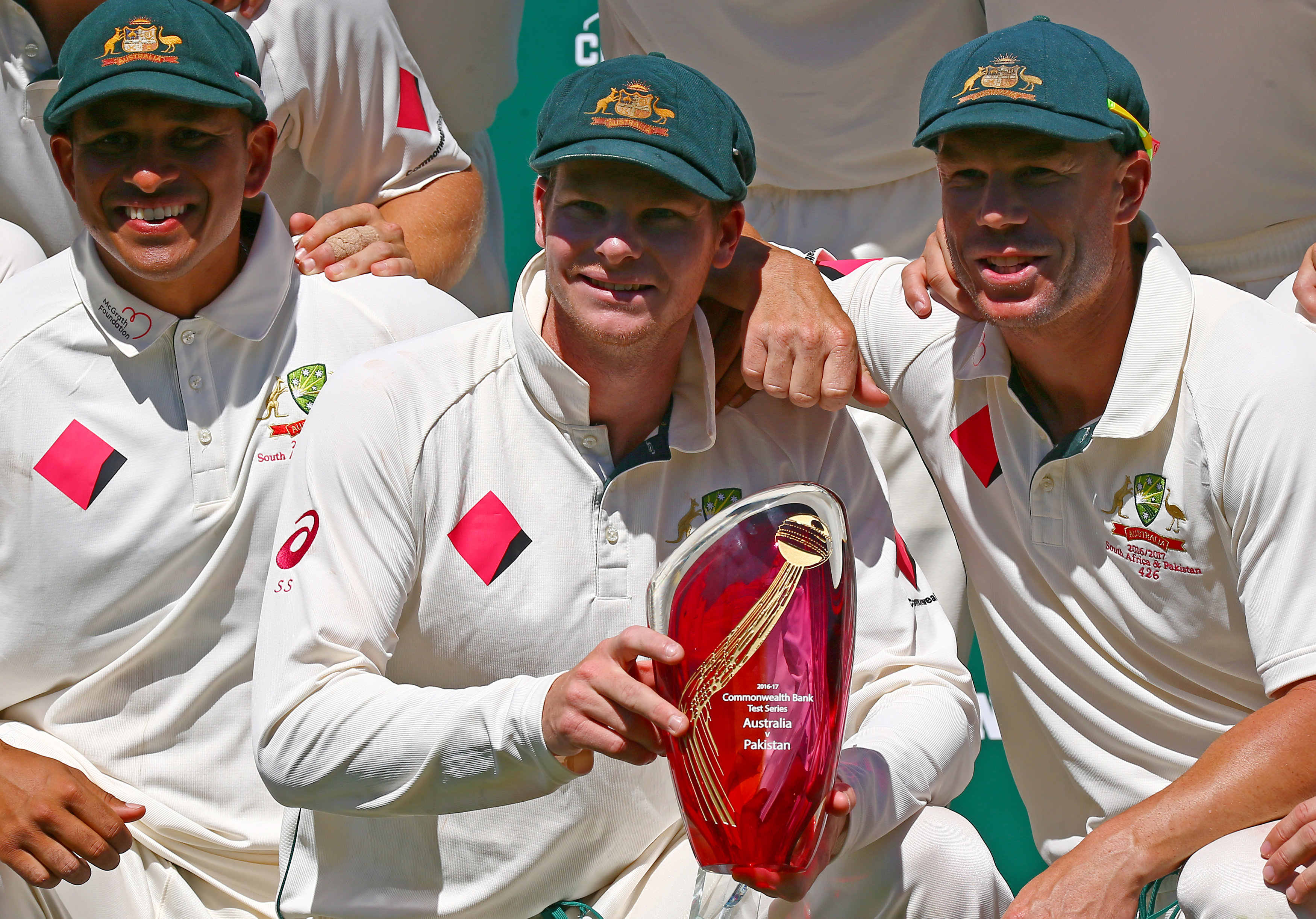 steve smith holds the trophy as he poses with teammates david warner and usman khawaja photo reuters david gray