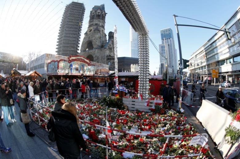 flowers and candles are placed at the christmas market at breitscheid square in berlin germany december 30 2016 following an attack by a truck which ploughed through a crowd at the market photo reuters