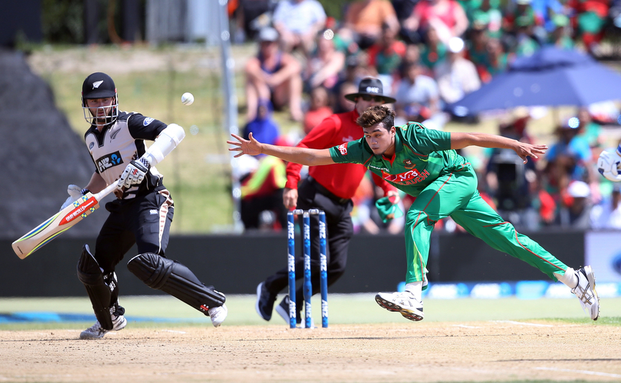 taskin ahmed c of bangladesh fields off his own bowling during the 20 20 international cricket match between new zealand and bangladesh at bay oval in mount maunganui on january 8 2017 photo afp