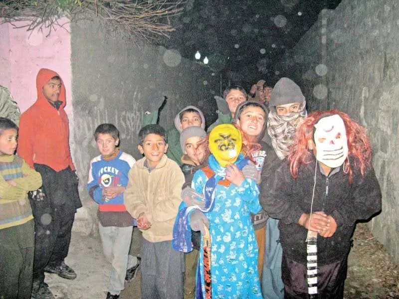 children go door to door during the winter season performing a traditional play dressed in different costumes in gilgit photo express children go door to door during the winter season performing a traditional play dressed in different costumes in gilgit photo express