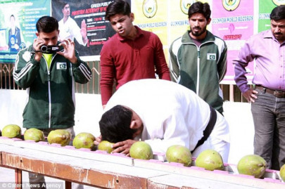 pakistani man smashes record breaking number of coconuts with his head