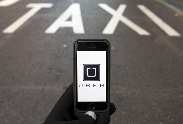 the logo of car sharing service app uber on a smartphone photo reuters