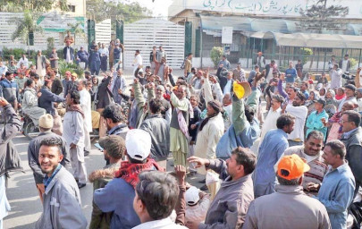 on strike workers union protests outsourcing of garbage lifting