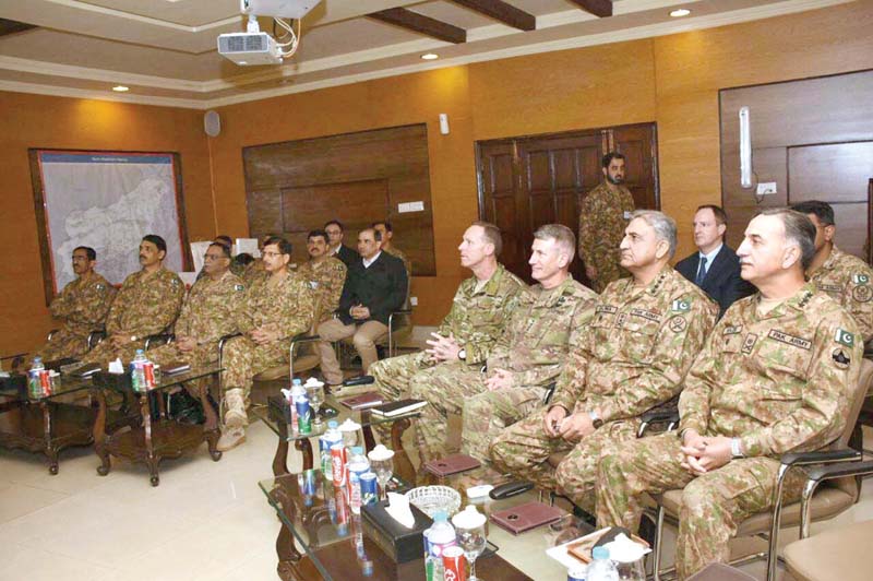 gen qamar bajwa and commander rsm gen john nicholson attend a briefing during their visit to miramshah photo app