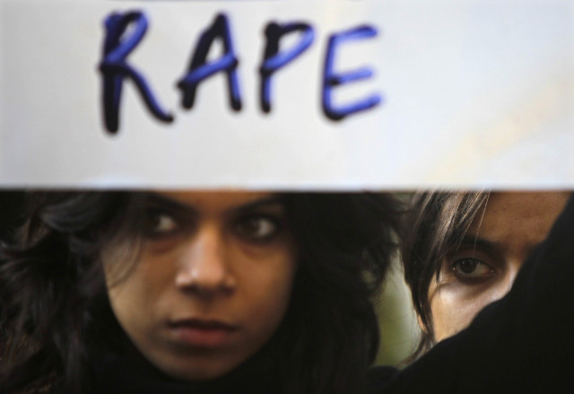 a protester holds a placard during a rally demanding the state government to ensure the safety of women in the capital city photo reuters a protester holds a placard during a rally demanding the state government to ensure the safety of women in the capital city photo reuters