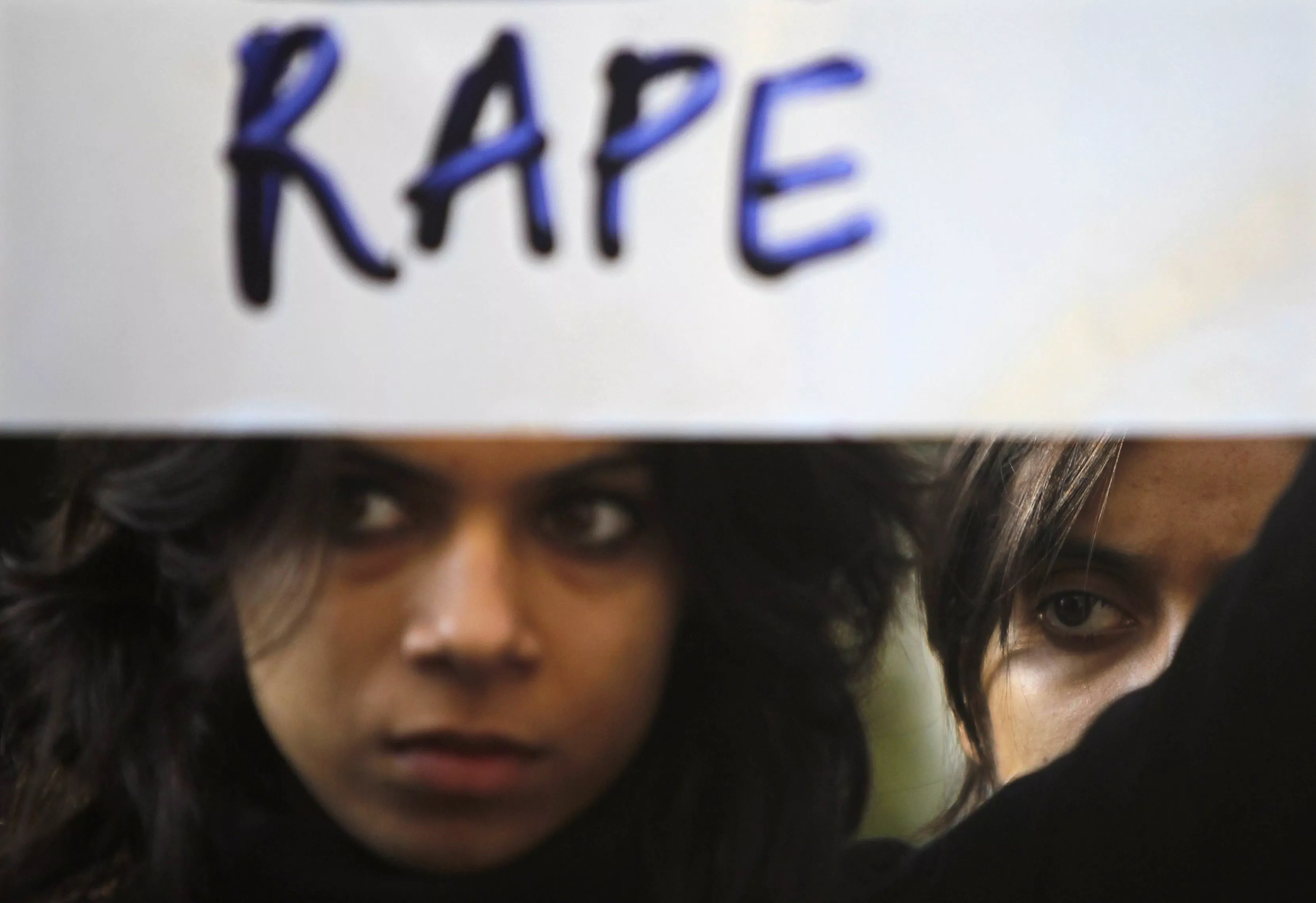 a protester holds a placard during a rally demanding the state government to ensure the safety of women in the capital city photo reuters a protester holds a placard during a rally demanding the state government to ensure the safety of women in the capital city photo reuters