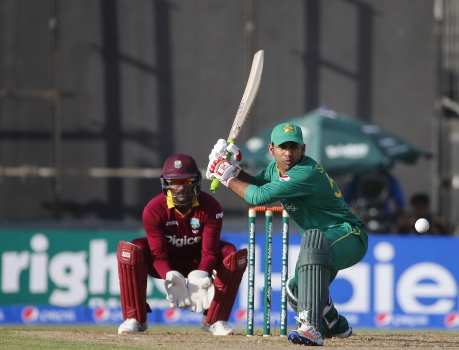pakistan t20i captain sarfaz ahmed r hits the ball as west indies 039 wicketkeeper densh ramdin l fields photo afp