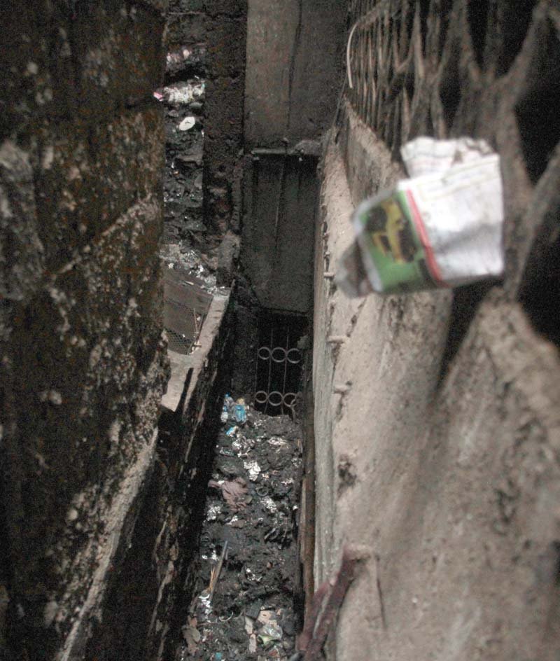 a view of the alley located between noor manzil and fatima manzil apartments where the large pile of garbage that caught fire had accumulated photo athar khan express