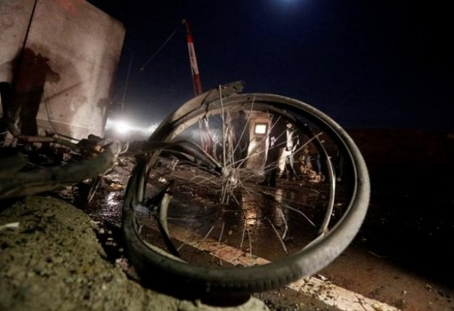 a bicycle lies on the ground as policemen keep watch at the site of suicide attack in kabul afghanistan january 10 2017 photo reuters a bicycle lies on the ground as policemen keep watch at the site of suicide attack in kabul afghanistan january 10 2017 photo reuters