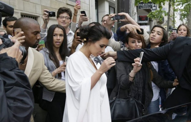 kim kardashian and kanye west in paris photo afp kim kardashian and kanye west in paris photo afp