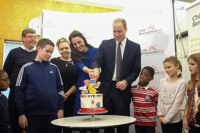 the duke and duchess of cambridge cut a cake as the london centre marks its one year anniversary on wednesday photo kensington palace