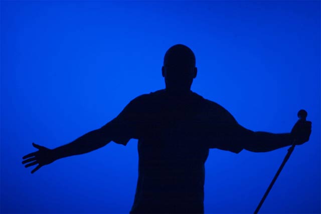 donald lacy in silhouette performing
