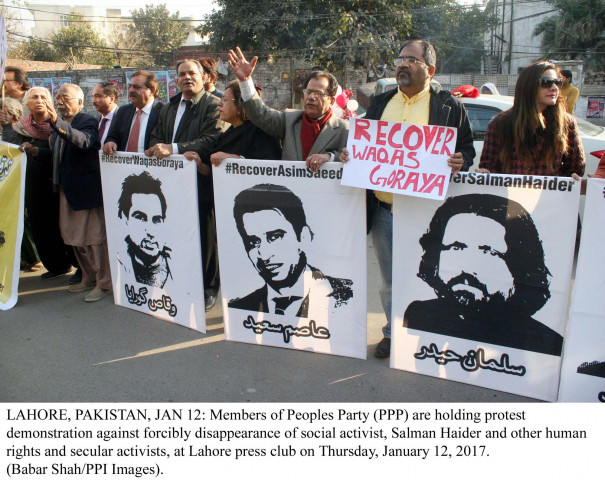 members of ppp are holding protest demonstration against forcibly disappearance of social activist salman haider and other human rights activists at lahore press club photo ppi members of ppp are holding protest demonstration against forcibly disappearance of social activist salman haider and other human rights activists at lahore press club photo ppi