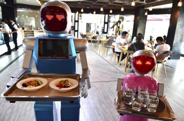 robots carry trays of food at a restaurant in jinhua zhejiang province china may 18 2015 photo reuters robots carry trays of food at a restaurant in jinhua zhejiang province china may 18 2015 photo reuters