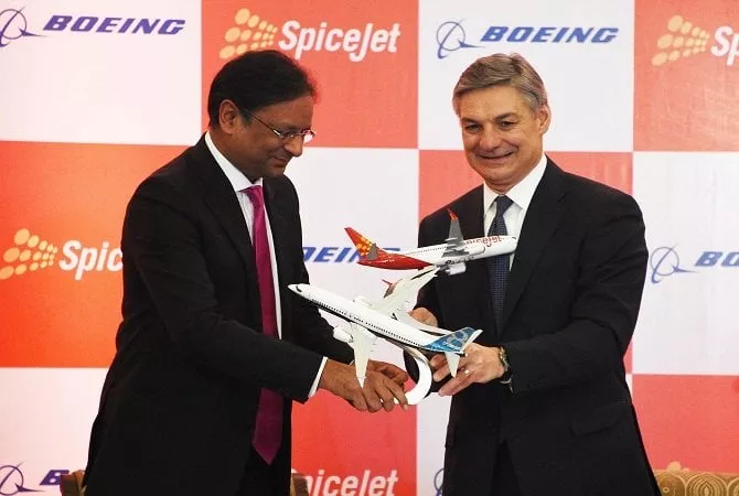 spicejet chairman ajay singh l and raymond l conner r vice chairman of boeing exchange model planes at a press conference in new delhi on january 13 2017 photo afp spicejet chairman ajay singh l and raymond l conner r vice chairman of boeing exchange model planes at a press conference in new delhi on january 13 2017 photo afp