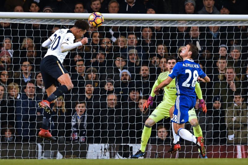 alli was at the double in tottenham s chelsea win and his manager believes he is happy in north london despite interest from real madrid photo afp