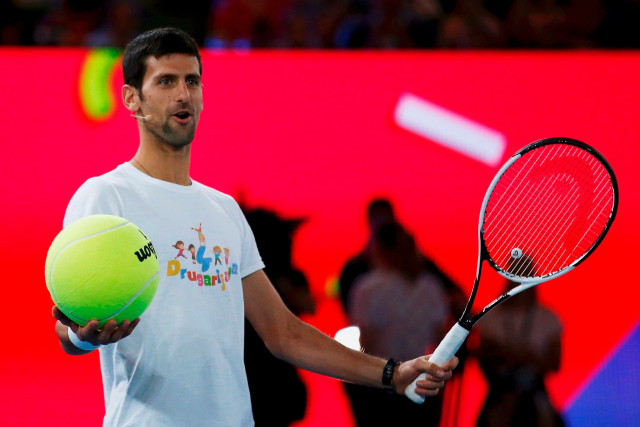 serbia 039 s novak djokovic holds a large tennis ball during a promotional event ahead of the australian open in melbourne on january 14 2017 photo reuters serbia 039 s novak djokovic holds a large tennis ball during a promotional event ahead of the australian open in melbourne on january 14 2017 photo reuters
