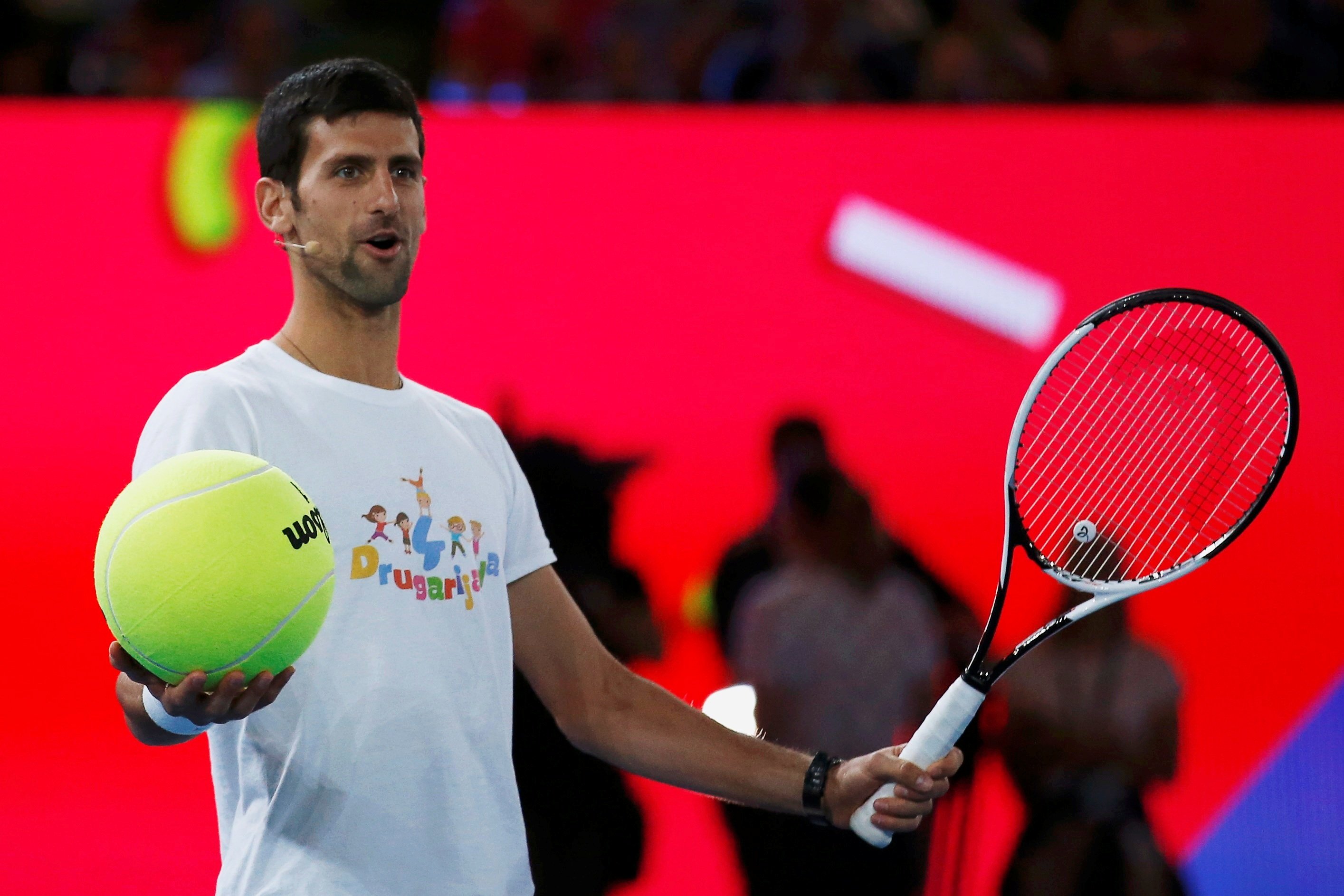 serbia 039 s novak djokovic holds a large tennis ball during a promotional event ahead of the australian open in melbourne on january 14 2017 photo reuters