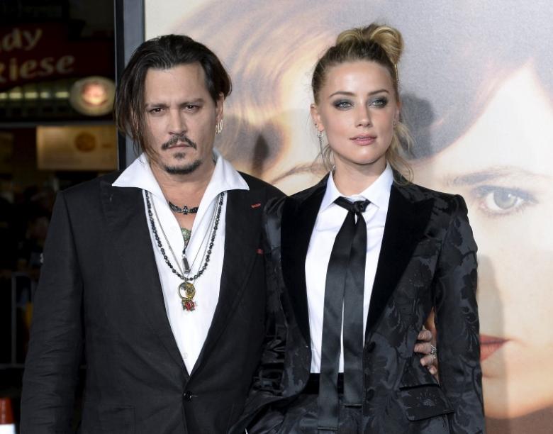 cast member amber heard and husband johnny depp pose during the premiere of the film quot the danish girl quot in los angeles california november 21 2015 reuters kevork djansezian file photo   rtx2lacu