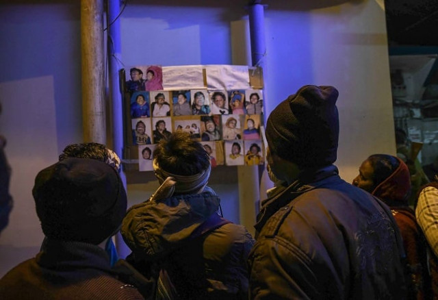 relatives look at the images of people who drowned in a boat accident on the river ganges near patna in eastern india on january 15 2017 at least 19 people died january 14 after a boat carrying some 40 revellers returning from a kite festival capsized in the ganges river in eastern india police said photo afp relatives look at the images of people who drowned in a boat accident on the river ganges near patna in eastern india on january 15 2017 at least 19 people died january 14 after a boat carrying some 40 revellers returning from a kite festival capsized in the ganges river in eastern india police said photo afp
