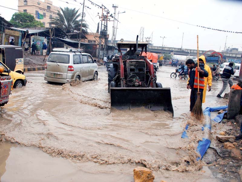 machineries of the municipalities came out on the streets to drain the roads of rain and sewage water that flooded the main roads such as liaquatabad above photo athar khan express