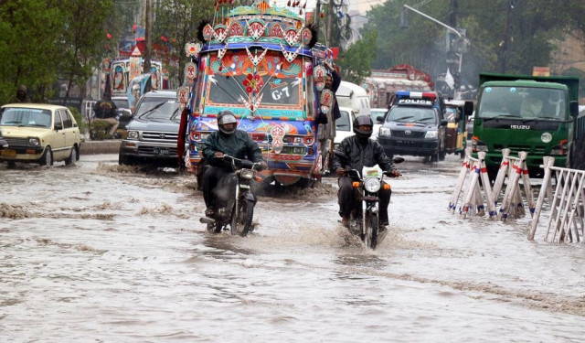rain water is seem accumulated on a road near tower photo online rain water is seem accumulated on a road near tower photo online