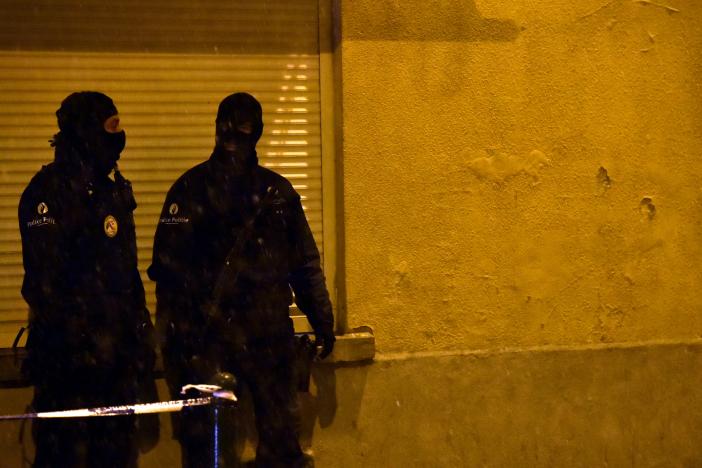 belgian police officers stand guard at the scene of a security operation in the brussels district of molenbeek belgium january 14 2017 photo reuters