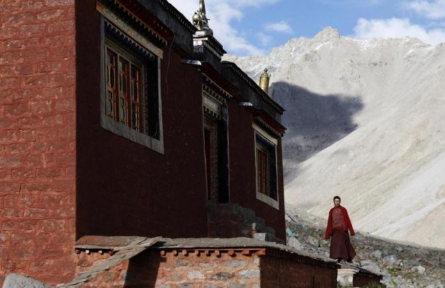 a tibetan monk stands outside a temple near mount kailash in ngari tibet autonomous region photo reuters a tibetan monk stands outside a temple near mount kailash in ngari tibet autonomous region photo reuters