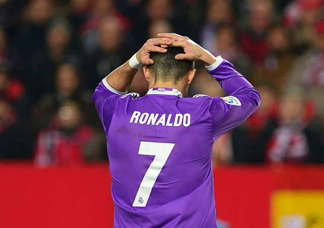 real madrid 039 s cristiano ronaldo reacts after missing a goal opportunity against sevilla fc at the ramon sanchez pizjuan stadium in sevilla on january 15 2017 photo afp real madrid 039 s cristiano ronaldo reacts after missing a goal opportunity against sevilla fc at the ramon sanchez pizjuan stadium in sevilla on january 15 2017 photo afp