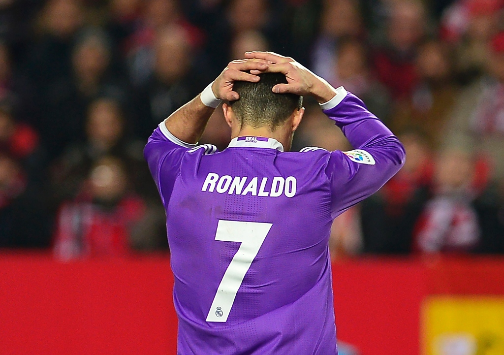 real madrid 039 s cristiano ronaldo reacts after missing a goal opportunity against sevilla fc at the ramon sanchez pizjuan stadium in sevilla on january 15 2017 photo afp