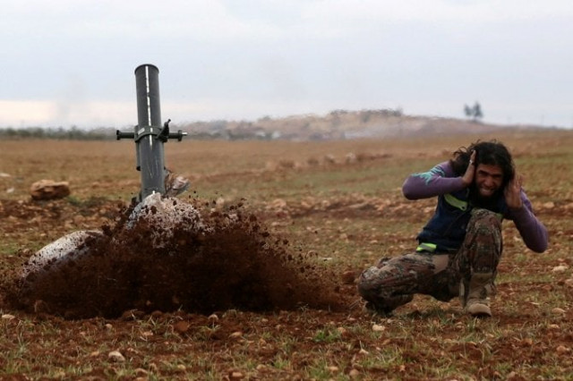 a rebel fighter reacts as he fires his weapon as rebels advance towards the northern syrian town of al bab syria january 15 2017 photo reuters a rebel fighter reacts as he fires his weapon as rebels advance towards the northern syrian town of al bab syria january 15 2017 photo reuters