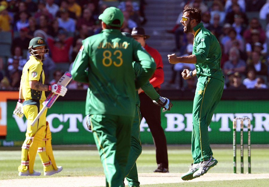 pakistan bowler imad wasim r celebrates after dismissing australia 039 s batsman steve smith as fellow batsman matthew wade l looks on during their one day international odi cricket match played at the mcg in melbourne on 15 january 2017 photo afp