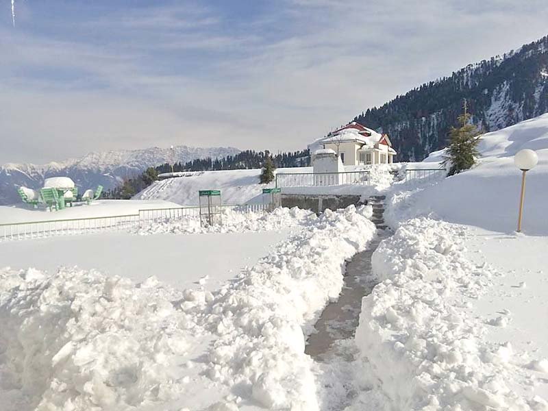 visitors enjoy the panoramic view enhanced by the scenic beauty surrounding the hill station photo express