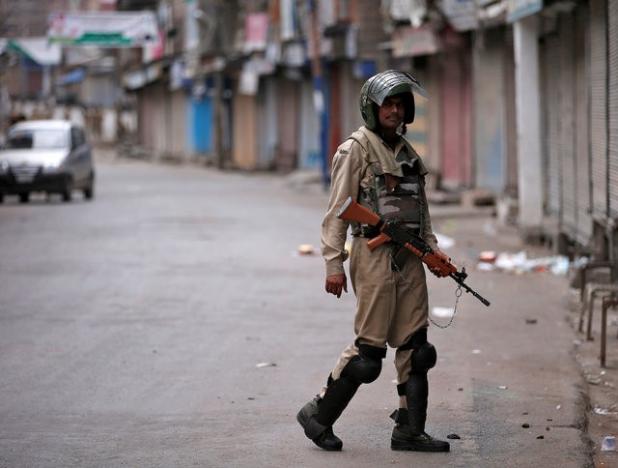 an indian policeman stands guard in a deserted street during a curfew in srinagar july 16 2016 reuters danish ismail