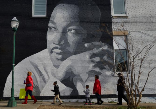 people gather to march in the annual parade down mlk boulevard to honor martin luther king in chattanooga tennessee us january 16 2017 photo reuters people gather to march in the annual parade down mlk boulevard to honor martin luther king in chattanooga tennessee us january 16 2017 photo reuters