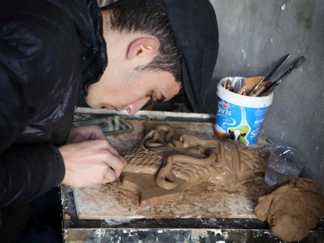 ninos thabet an 18 year old christian who studied art at mosul university creates miniature replicas of statues destroyed by militants when they overran the 3 000 year old assyrian city of nimrud 2 1 2 years ago in erbil iraq january 13 2017 picture taken january 13 2017 reuters girish gupta