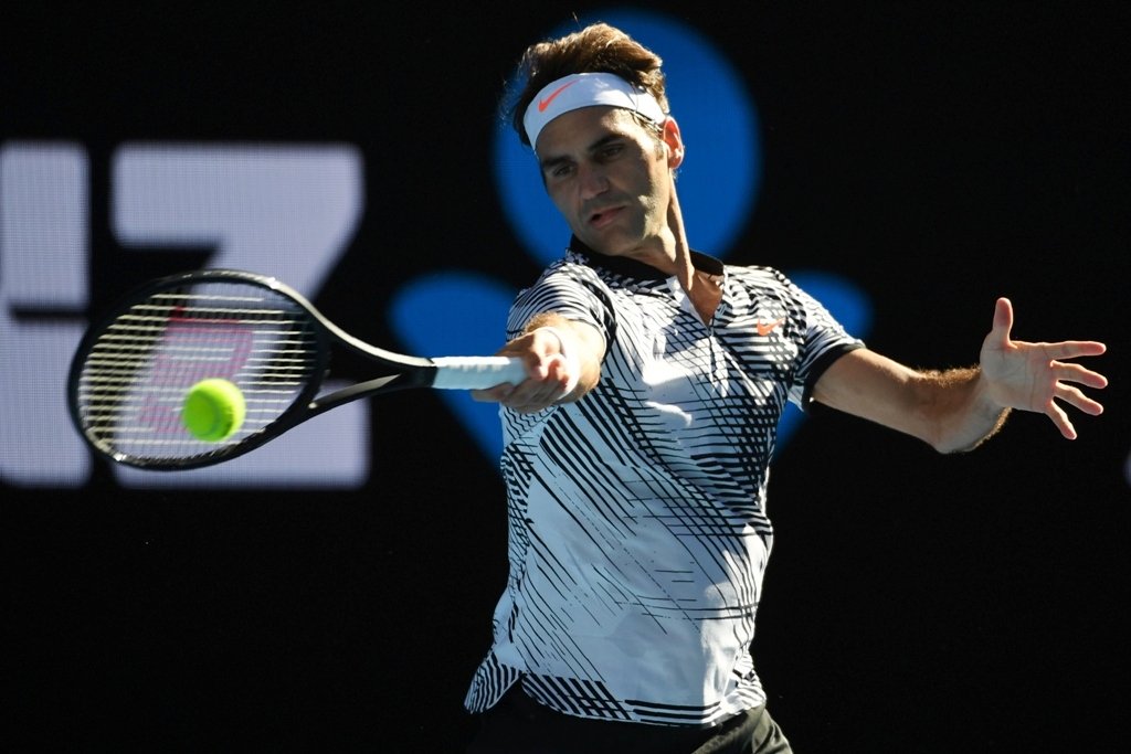 roger federer hits a return against noah rubin during their australian open match photo afp