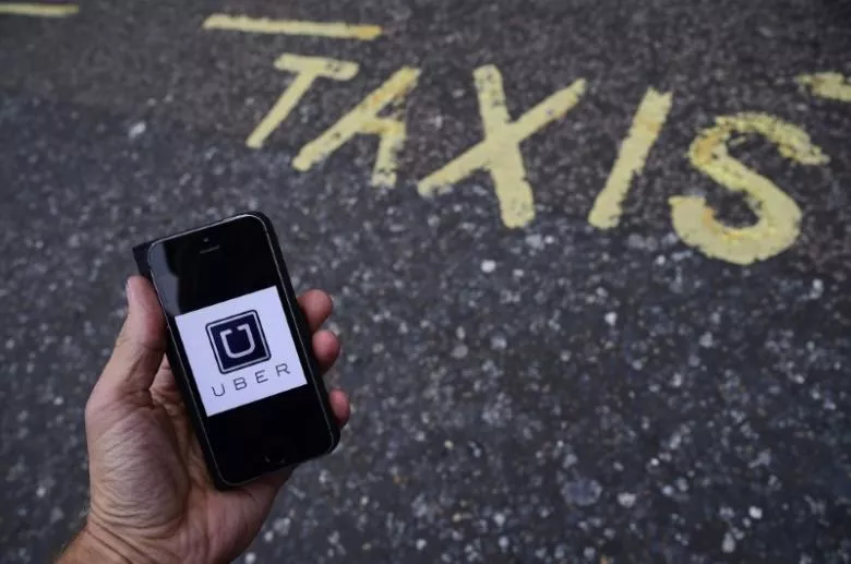 a photo illustration shows the uber app logo displayed on a mobile telephone as it is held up for a posed photograph in central london britain october 28 2016 photo reuters a photo illustration shows the uber app logo displayed on a mobile telephone as it is held up for a posed photograph in central london britain october 28 2016 photo reuters