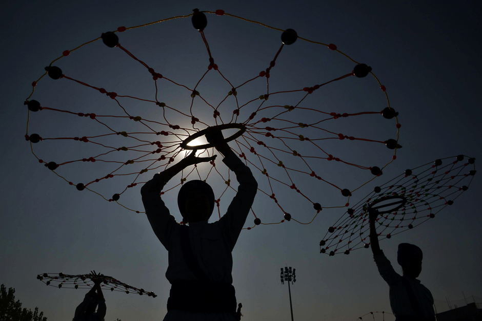 Indian Sikh participants perform 'Gatka' the Sikh martial art during a competition in Amritsar. Gatka, is a traditional South Asian form of combat-training, developed by Sikhs, in which wooden sticks are used to simulate swords in sparring matches, other weapons are not used for full-contact sparring, but their techniques are taught through forms training. PHOTO: AFP