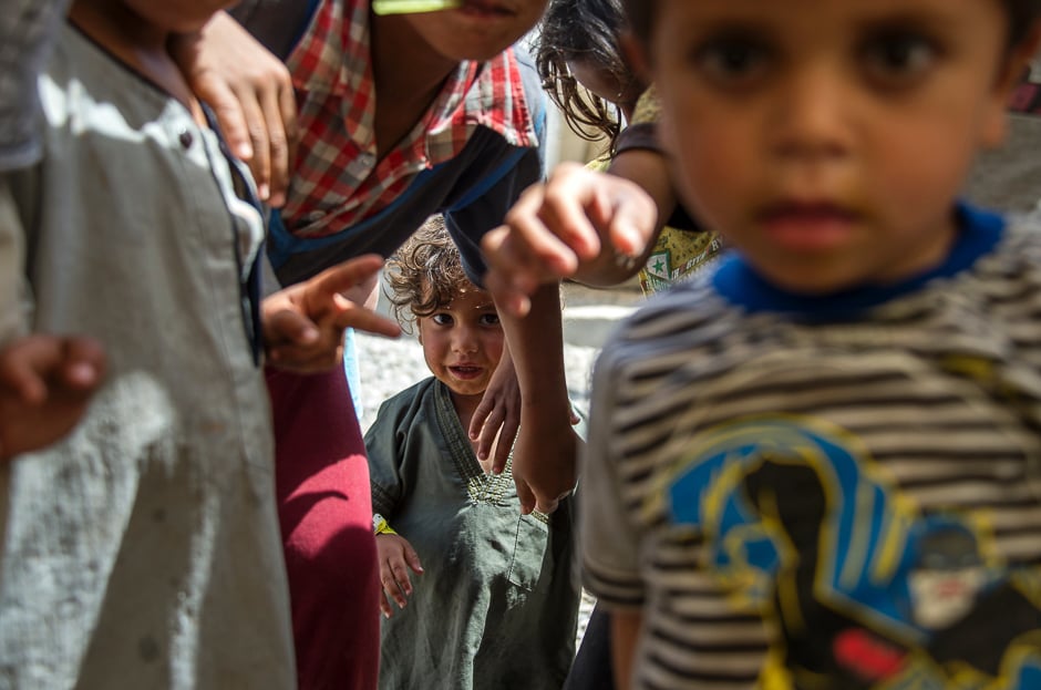 Iraqi children pose for a photo at a camp for internally displaced people in Hammam al-Alil after fleeing West Mosul due to the ongoing battles between government forces and Islamic State (IS) group militants. PHOTO: AFP