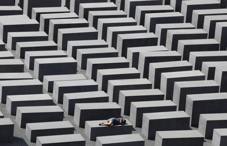 file photo a girl rests on a concrete column of the holocaust memorial in berlin germany june 17 2011 reuters tobias schwarz file photo