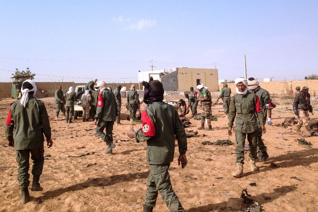 soldiers attend to wounded and casualties following a suicide bomb attack in gao northern mali on january 18 2017 photo afp