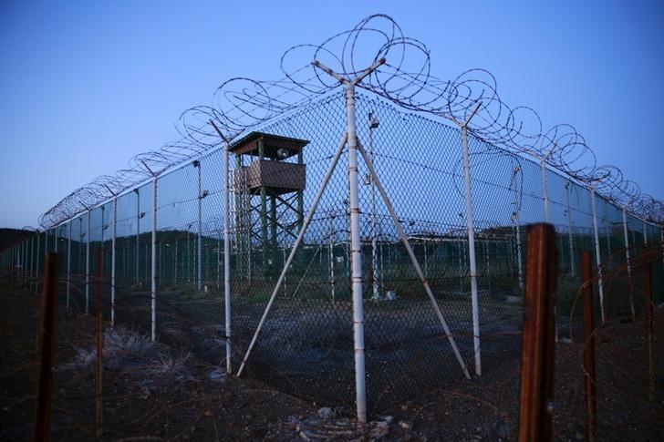 chain link fence and concertina wire surrounds a deserted guard tower within joint task force guantanamo 039 s camp delta at the u s naval base in guantanamo bay cuba march 21 2016 reuters lucas jackson file photo