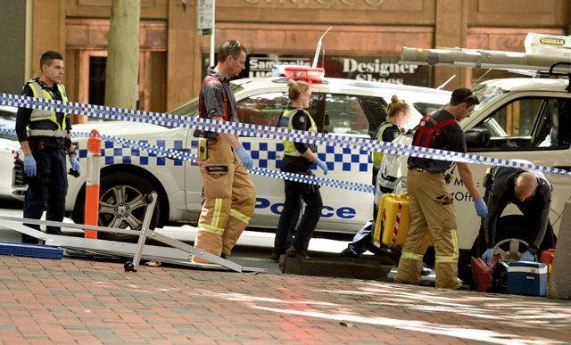 emergency servicemen and police are seen on bourke street after a car ploughed into pedestrians in the centre of melbourne on january 20 2017 three people died and 20 more were hurt on january 20 when a car ploughed into pedestrians in the australian city of melbourne but police said it was not a terror attack photo afp