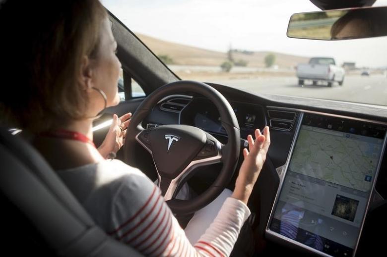 new autopilot features are demonstrated in a tesla model s during a tesla event in palo alto california photo reuters