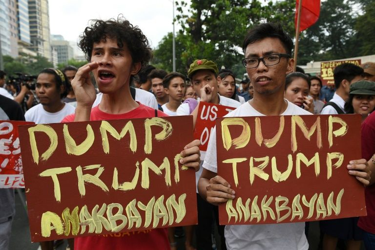 students shout slogans against the us president elect donald trump during a rally in front of the us embassy in manila in november 2016 photo afp