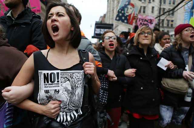 anti trump protesters chant during a demonstration on january 20 2017 in washington dc protesters attempted to block an entrance to the inauguration ceremony donald trump was sworn in as the 45th us president on january 20 2017 photo afp