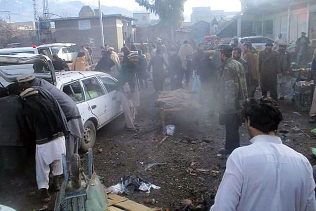 people are seen at the site of bomb blast at vegetable market in parachinar on january 21 2017 photo online