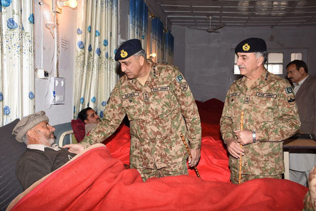 army chief general qamar javed bajwa inquires after a victim of parachinar blast at a local hospital on sunday january 22 2016 photo ispr