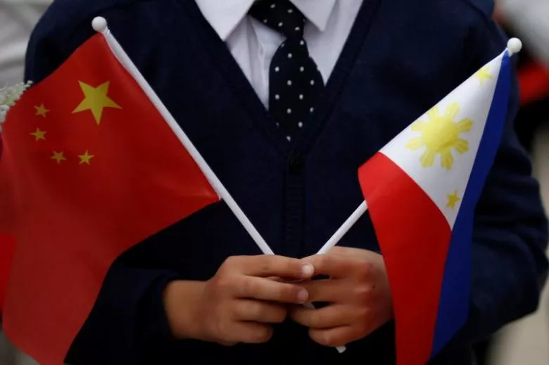 a child holds national flags of china and the philippines before president of the philippines rodrigo duterte and china 039 s president xi jinping attend a welcoming ceremony at the great hall of the people in beijing china october 20 2016 photo reuters a child holds national flags of china and the philippines before president of the philippines rodrigo duterte and china 039 s president xi jinping attend a welcoming ceremony at the great hall of the people in beijing china october 20 2016 photo reuters